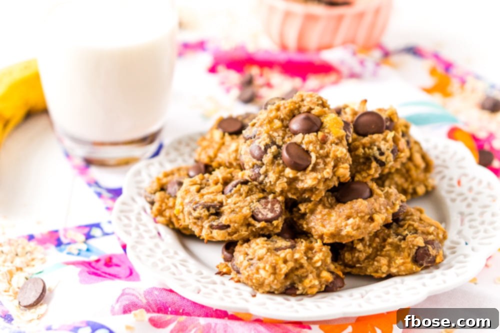Banana Oatmeal Cookies with chocolate chips on white plate.