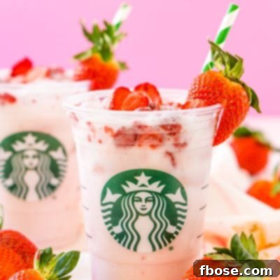 Freshly prepared Copycat Starbucks Pink Drink with strawberries.