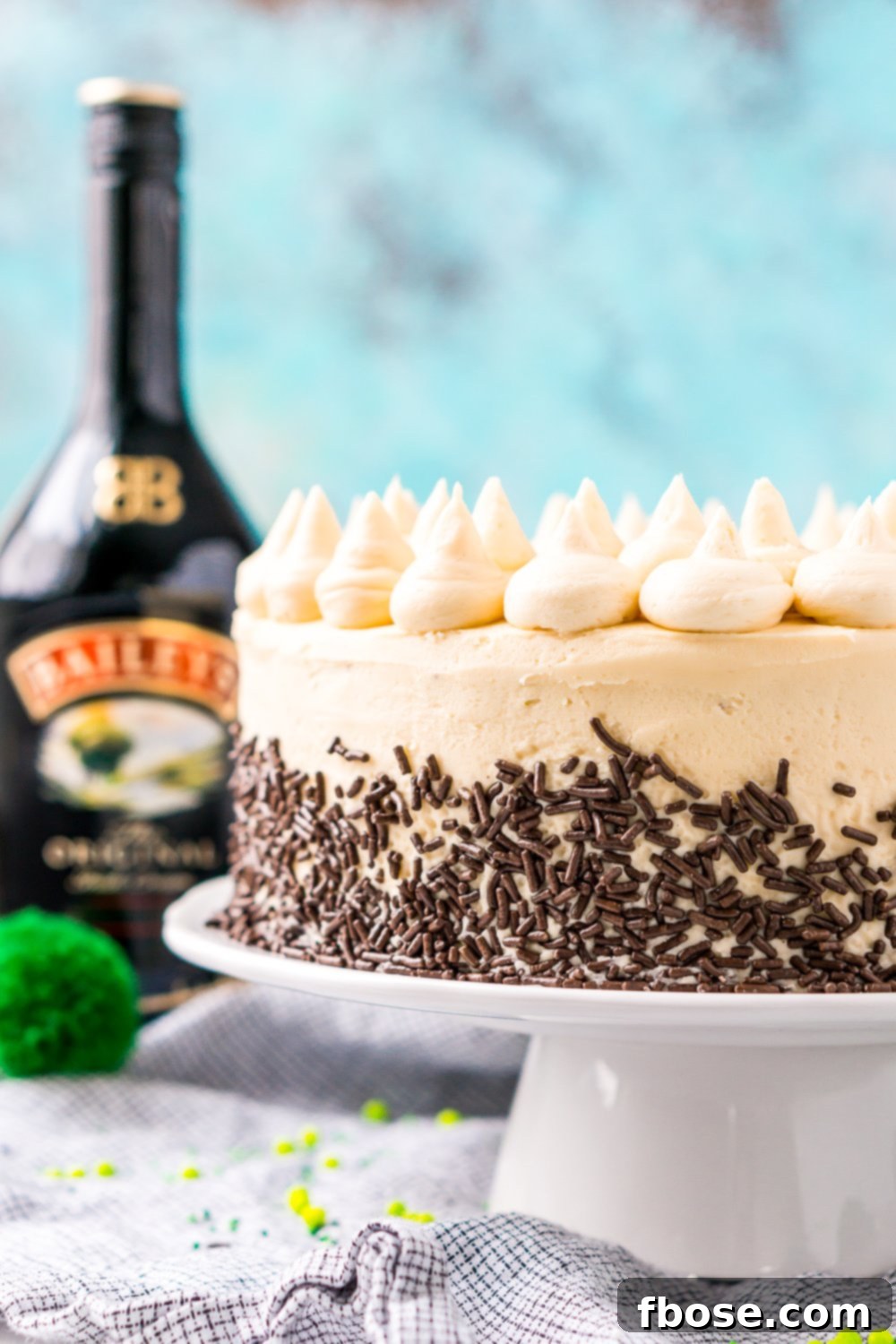 Close-up shot of the Chocolate Guinness Cake, showcasing its perfect layers and the smooth, decadent frosting, promising a rich flavor.