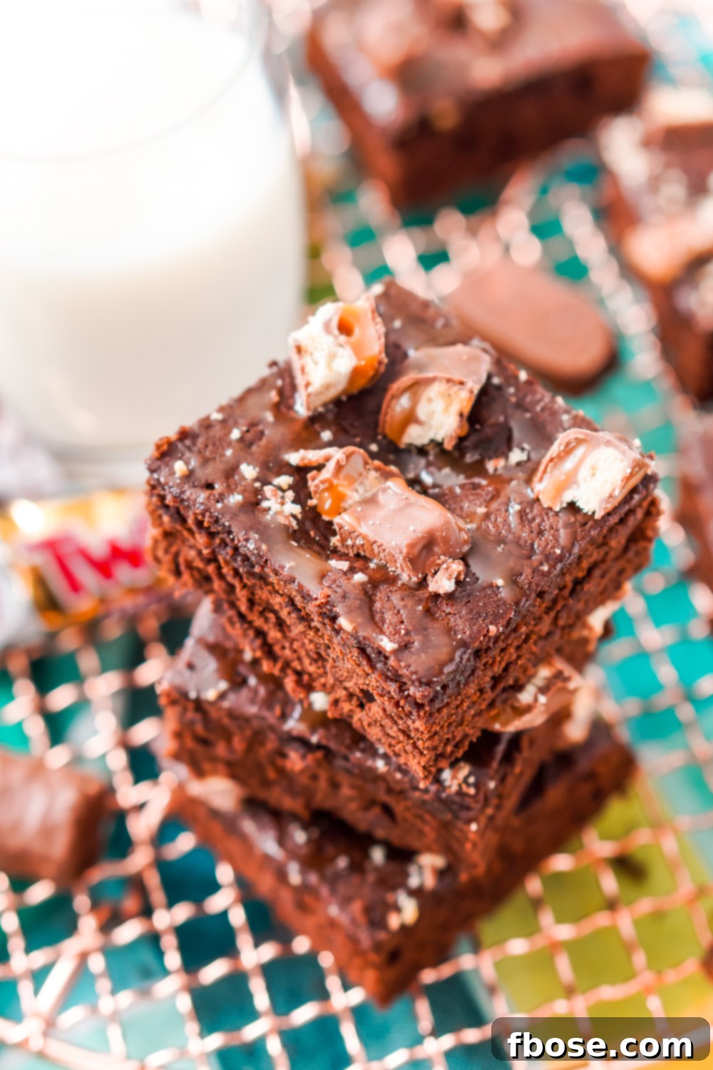 Twix Caramel Fudge Brownies 2 These Twix Caramel Brownies are a delicious cake-like chocolate brownie with Twix candy bars baked in, then drizzled with caramel and topped with more candy bar crumbles.
