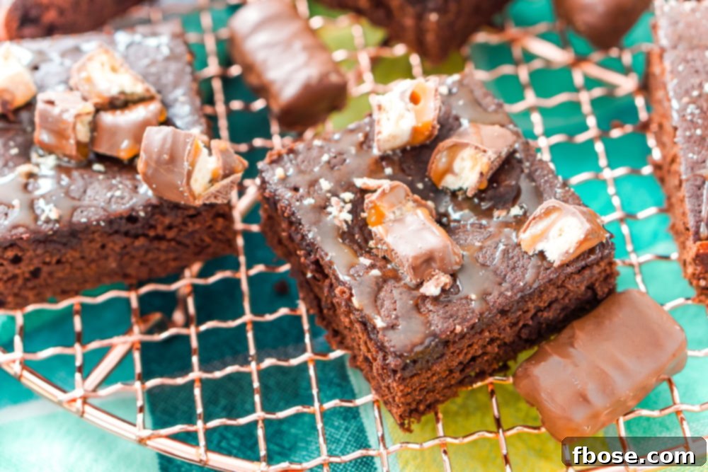 Twix Caramel Fudge Brownies 9 These Twix Caramel Brownies are a delicious cake-like chocolate brownie with Twix candy bars baked in, then drizzled with caramel and topped with more candy bar crumbles.