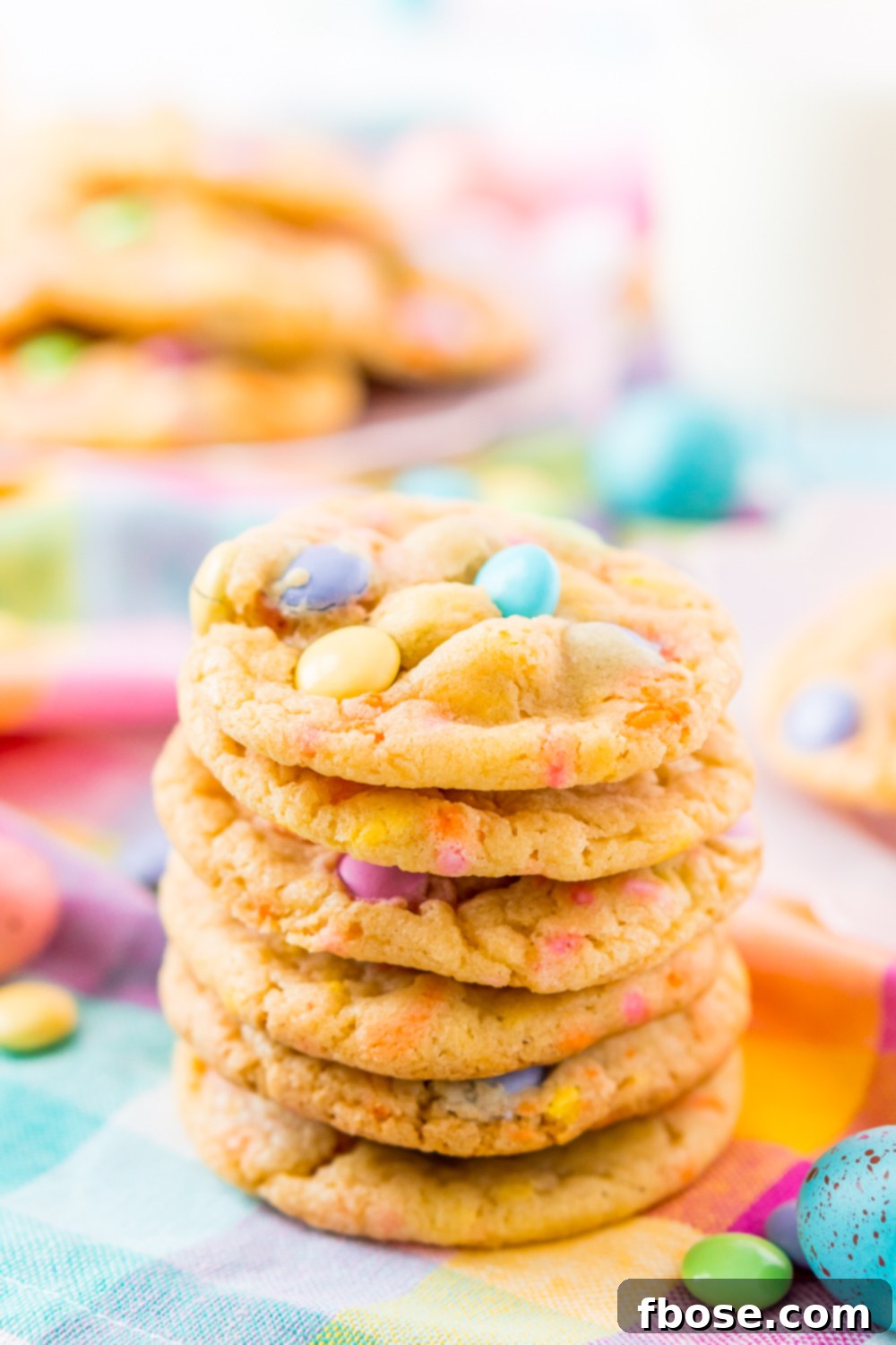 Close up photo of a stack of M&M cake mix cookies, showcasing their colorful appeal.