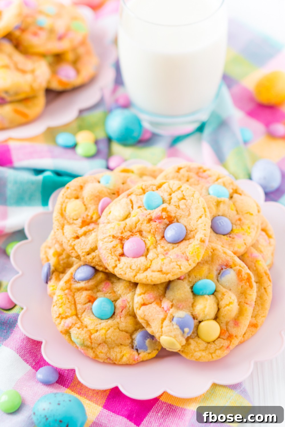 Vibrant Easter M&M cake mix cookies served on a delightful pink plate, ready to be enjoyed.