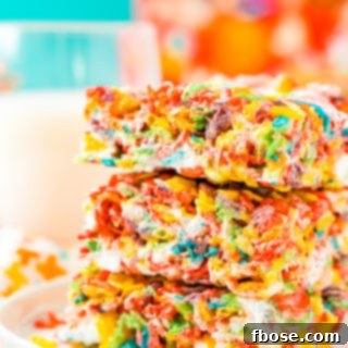 These Fruity Pebbles Treats are a fun and fruity twist on the classic no-bake dessert made with Rice Krispies cereal. They are made with the perfect blend of cereal, butter, and marshmallows and take just 7 minutes to prepare!