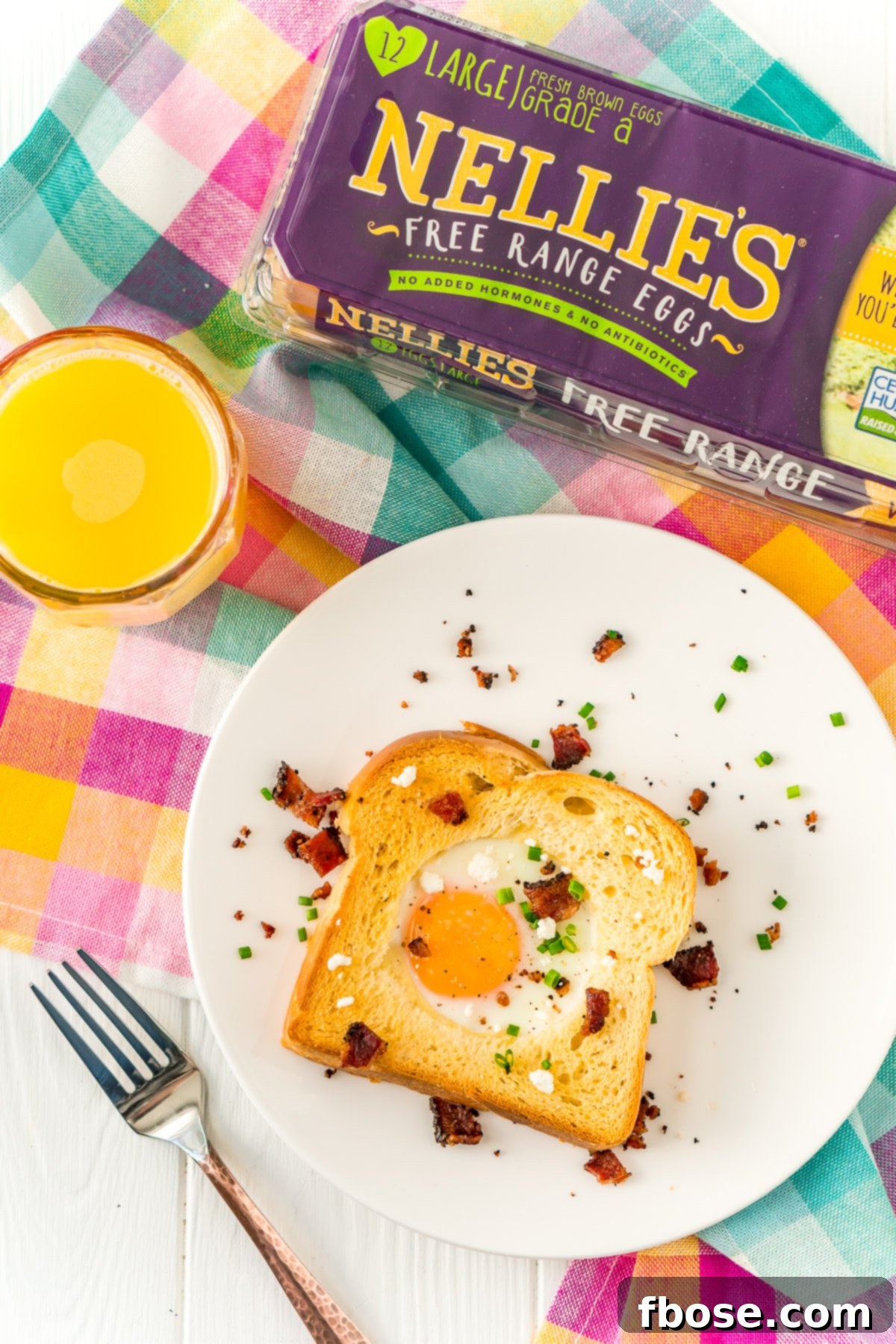 Sheet pan egg in a hole cooking in an oven for an easy breakfast or brunch.
