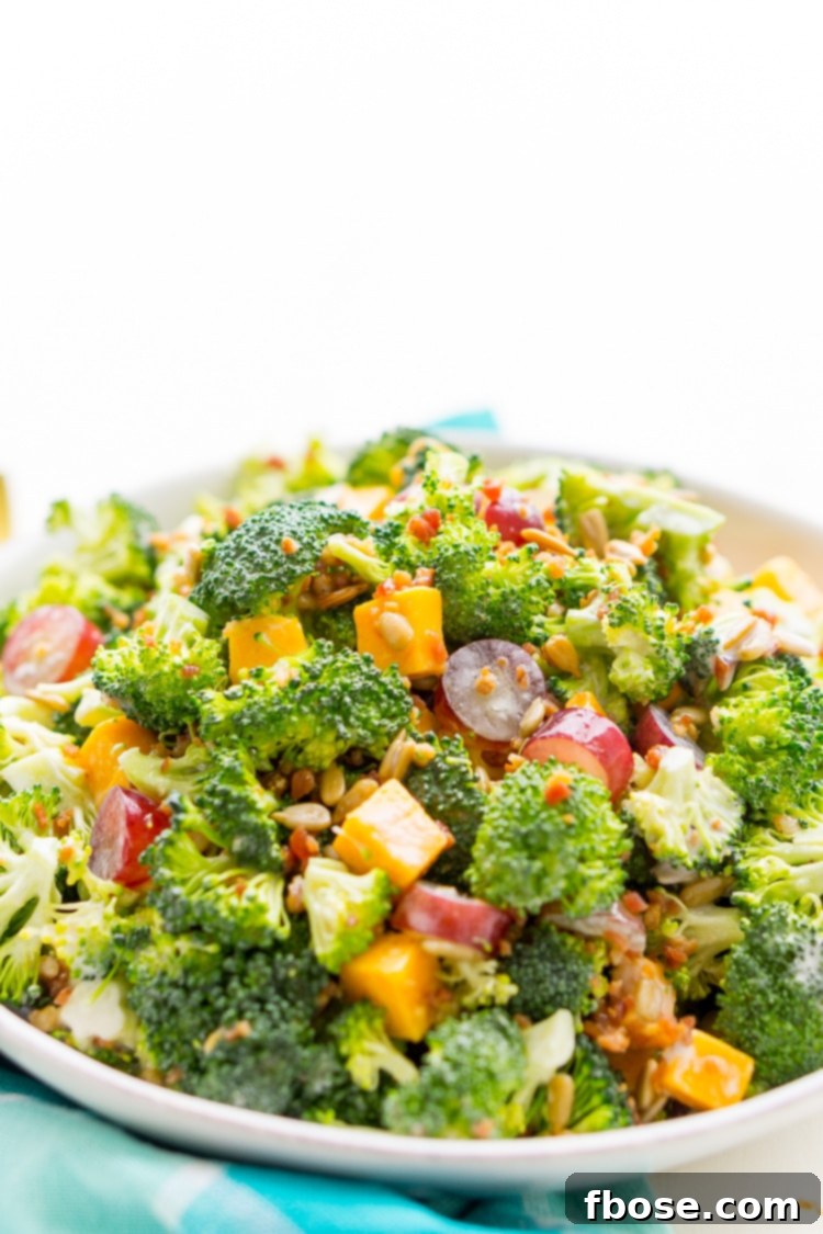 Broccoli Salad recipe with cheese, grapes, sunflowers seeds, and bacon