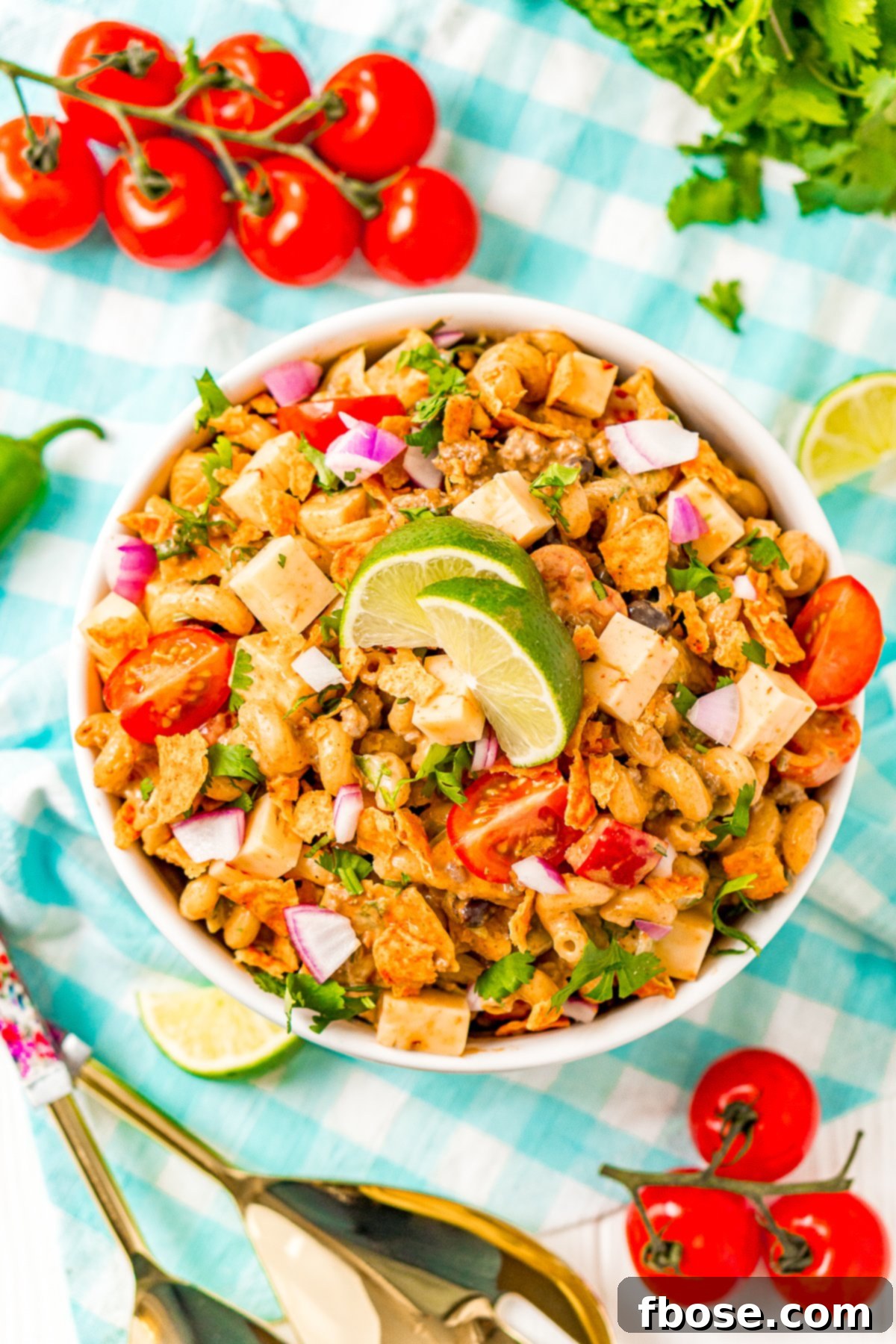 An inviting overhead shot of a prepared Taco Pasta Salad in a white serving bowl, showcasing its colorful ingredients and ready-to-eat appeal.