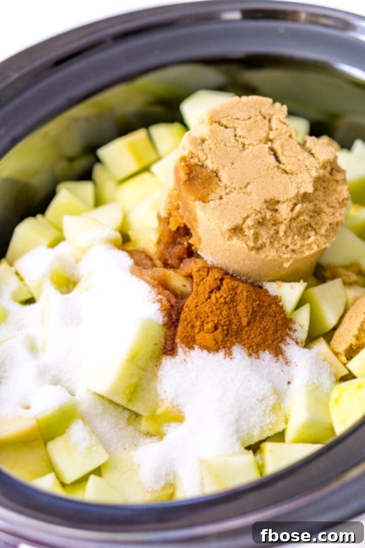 Preparing apples for Crockpot Apple Butter: peeled, cored, and chopped Granny Smith apples ready for slow cooking.