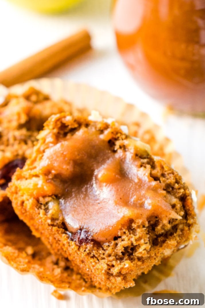 Homemade Apple Butter spread on a biscuit, perfect for a cozy fall breakfast.
