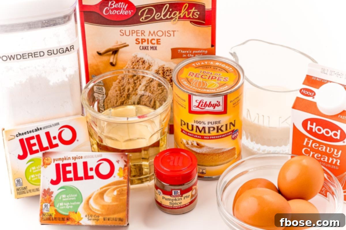 Ingredients to make pumpkin cupcakes laid out on a white table. This visual aid helps bakers gather all necessary items before starting, simplifying the process.
