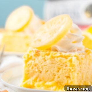Close up photo of a slice of lemon cake on a small white plate.