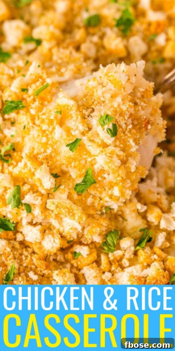 Close up image of a chicken breast being spooned out of a casserole dish.