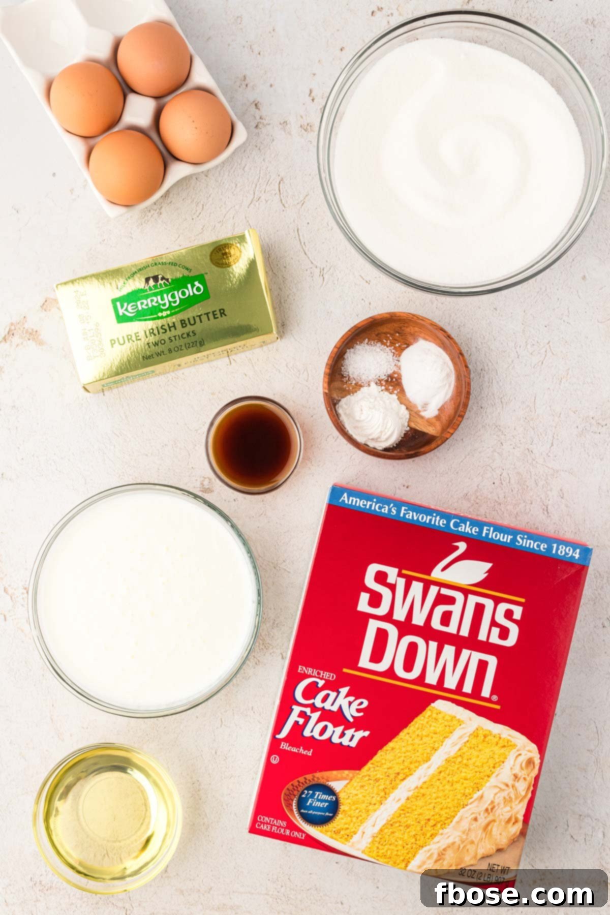 Ingredients to make yellow butter cake on a counter.