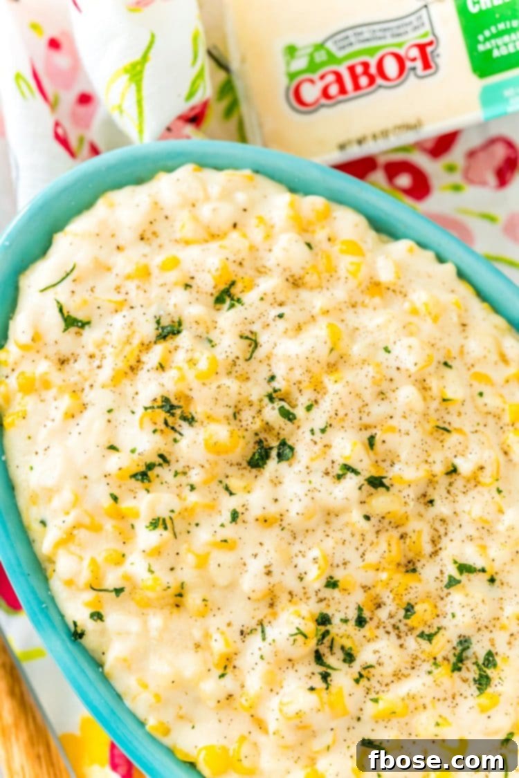 Slow Cooked Cheesy Corn Comfort 4 Close up photo of a bowl of cheesy corn.