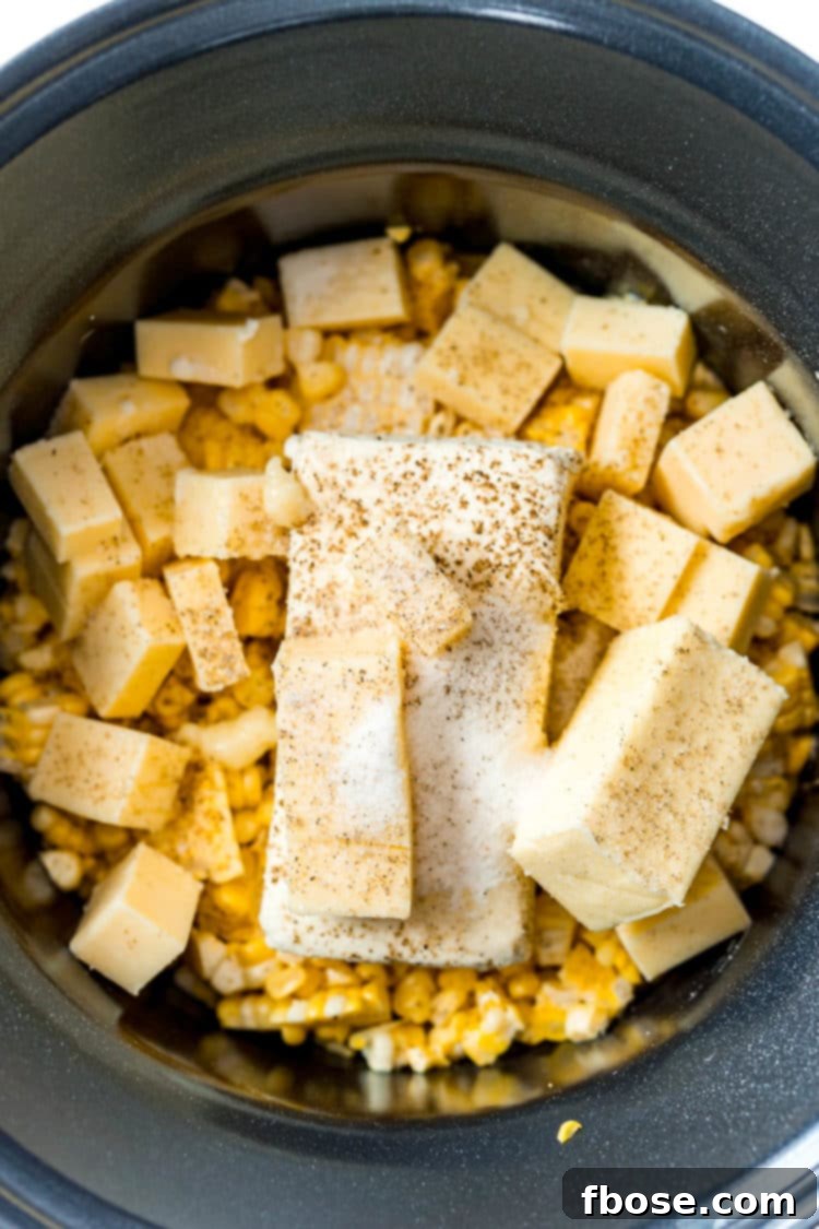 Slow Cooked Cheesy Corn Comfort 5 Ingredients for making cheesy corn in a crockpot ready to cook.