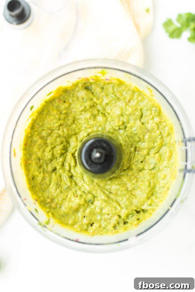 Guacamole 5 Overhead photo of guacamole in a food processor.