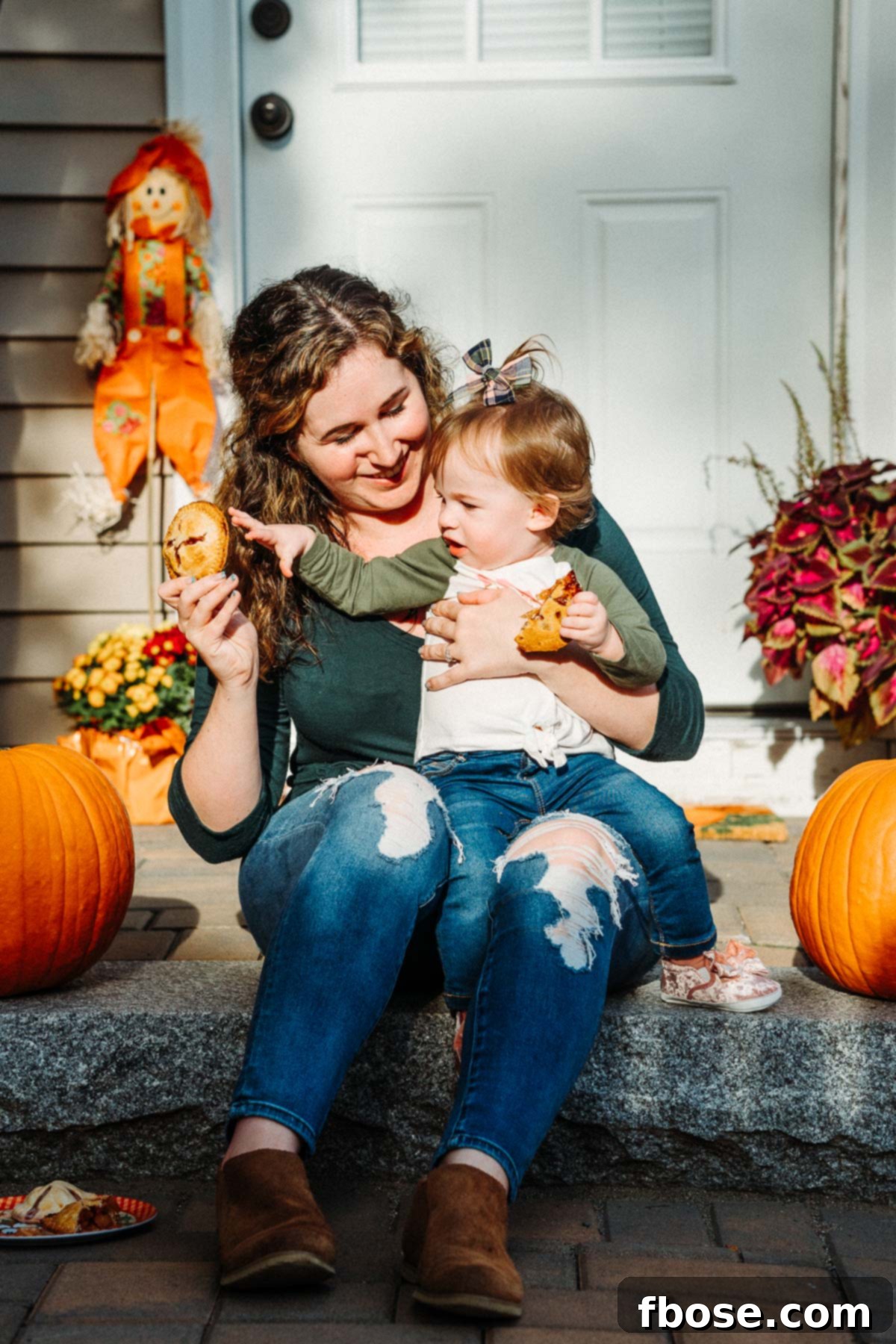 Golden Apple Hand Pies 8 Mother and toddler daughter eating pie on patio steps.