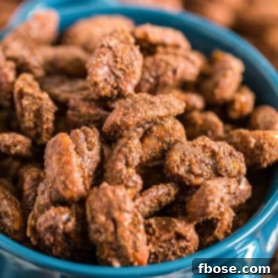 Gingerbread Candied Pecans in a blue serving bowl.