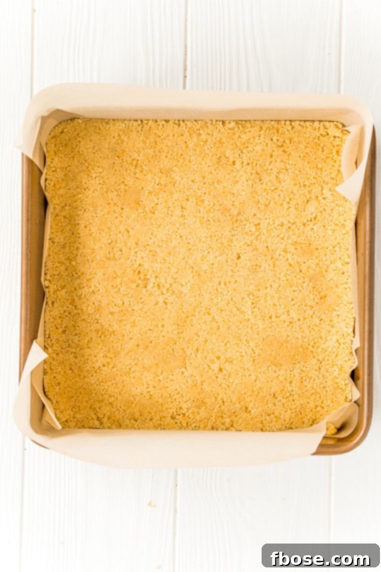 cookie crumbs in a square baking pan to make a crust.