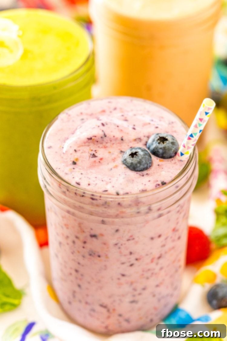 Close up photo of a smoothie with blueberries on it.