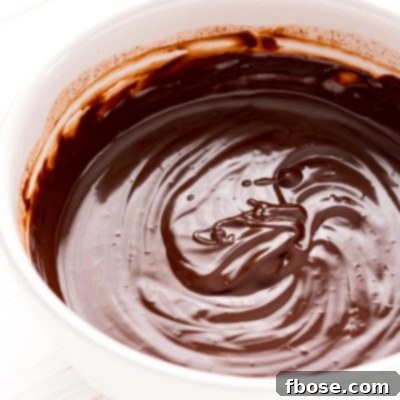 White bowl filled with chocolate ganache.