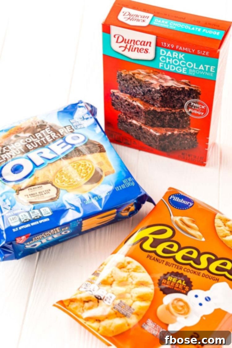 Ingredients for making delicious Peanut Butter Oreo Brownies, including cookie dough, Oreos, and brownie mix.