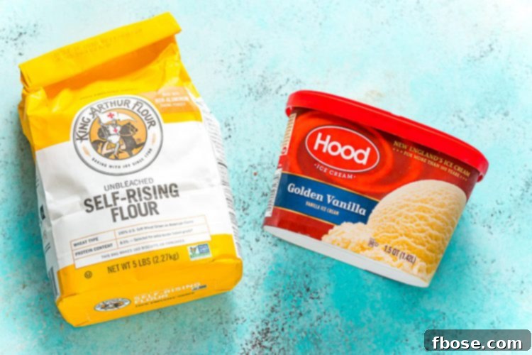 A package of self-rising flour and a tub of creamy vanilla ice cream are neatly arranged on a vibrant blue surface, highlighting the two core ingredients.