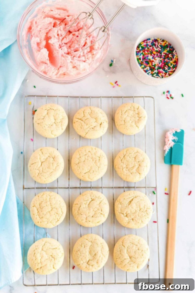 Soft sugar cookies cooling on a wire rack, ready for frosting and decoration.