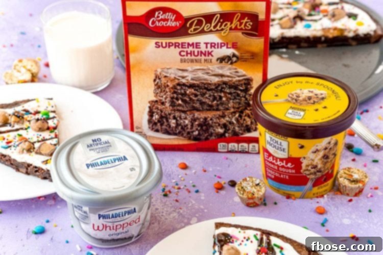 Ingredients to make brownie pizza on a purple surface surrounded by candy and brownie pizza slices on white plates.