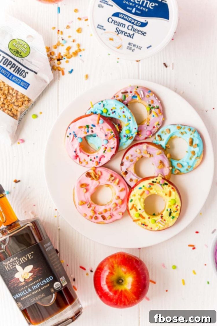 Apple donut slices on a white plate, artfully arranged with the fresh ingredients to make them scattered around, showcasing the wholesome components.