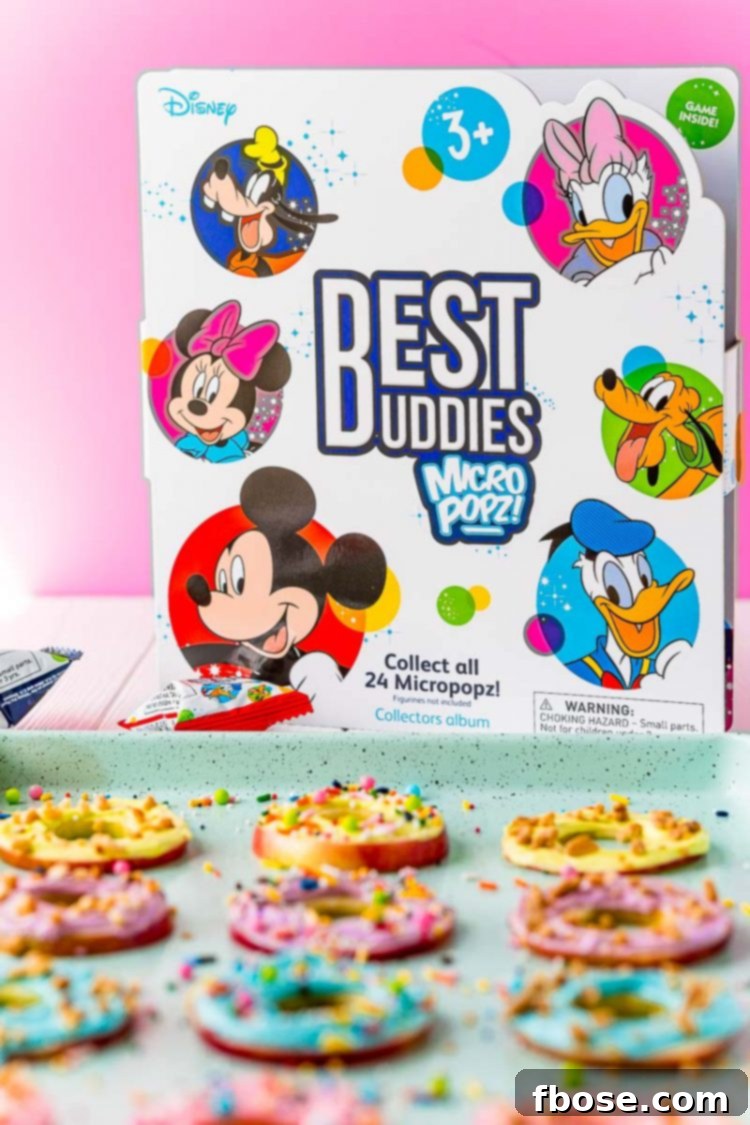 The collectors box for Best Buddies Micro Popz! positioned behind a delicious tray of apple donuts, inviting children's attention.