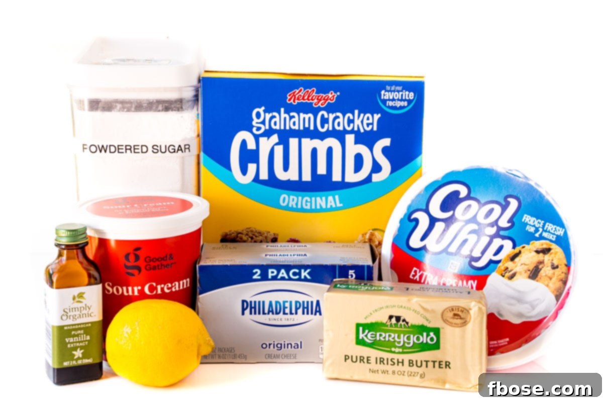 Ingredients to make no-bake-cheesecake on a white table.
