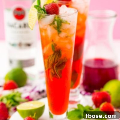 Strawberry mojitos in tall glasses.