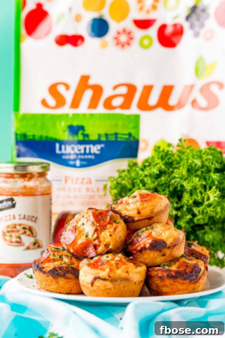 Mini pizzas in a white plate with ingredients in the background.