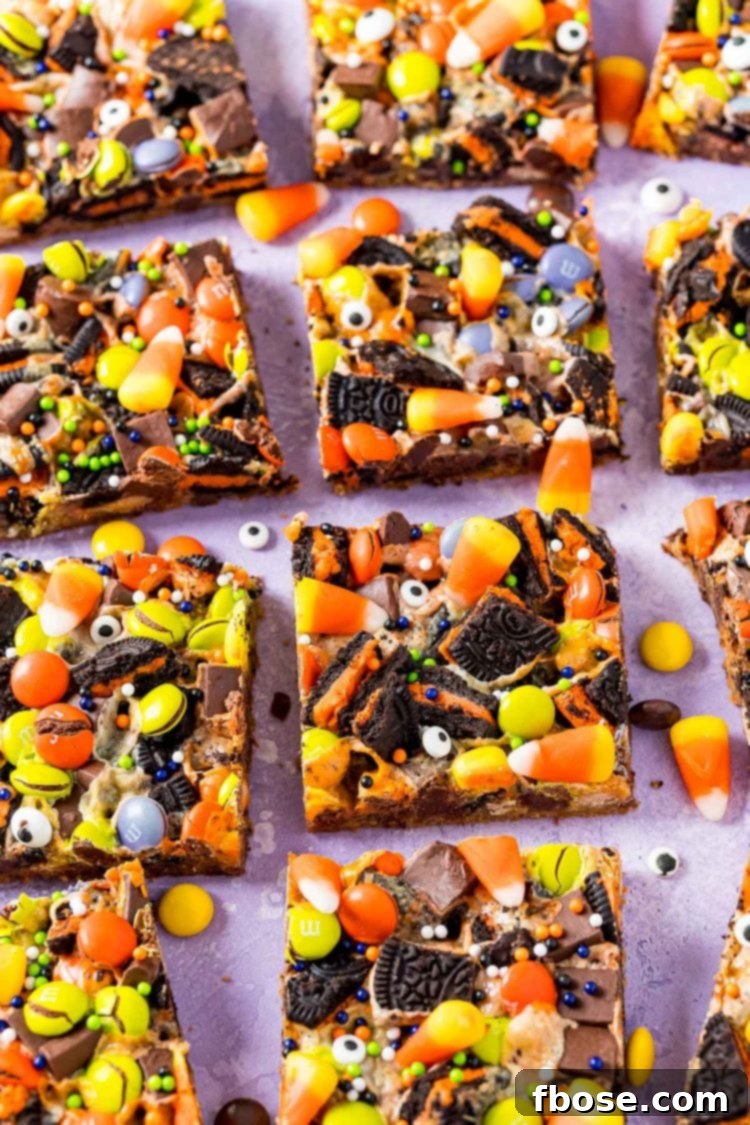Spellbound Seven-Layer Bars 3 Halloween 7 layer bars on a purple surface.