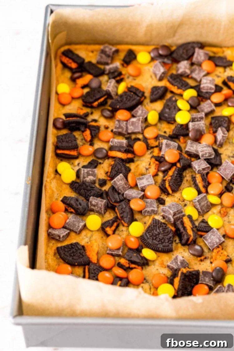 Spellbound Seven-Layer Bars 4 Halloween magic bars being prepared in a baking pan.
