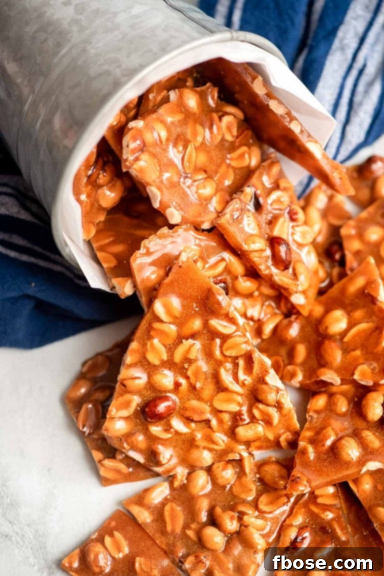 Peanut brittle coming out of a tin can.
