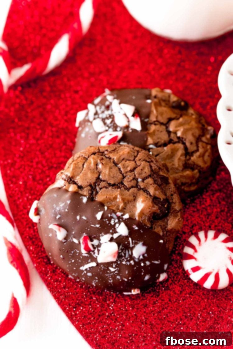Close up photo of Peppermint brownie cookies on a red glittery surface, highlighting their festive appeal.