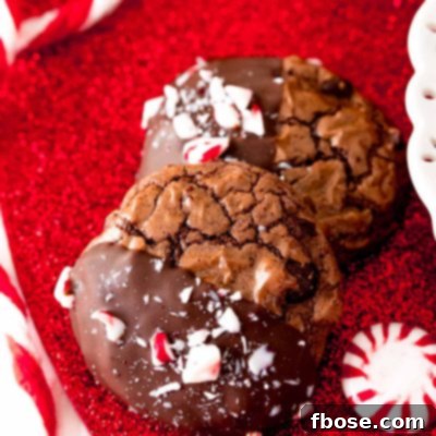 Close up photo of Peppermint brownie cookies on a red glittery surface.