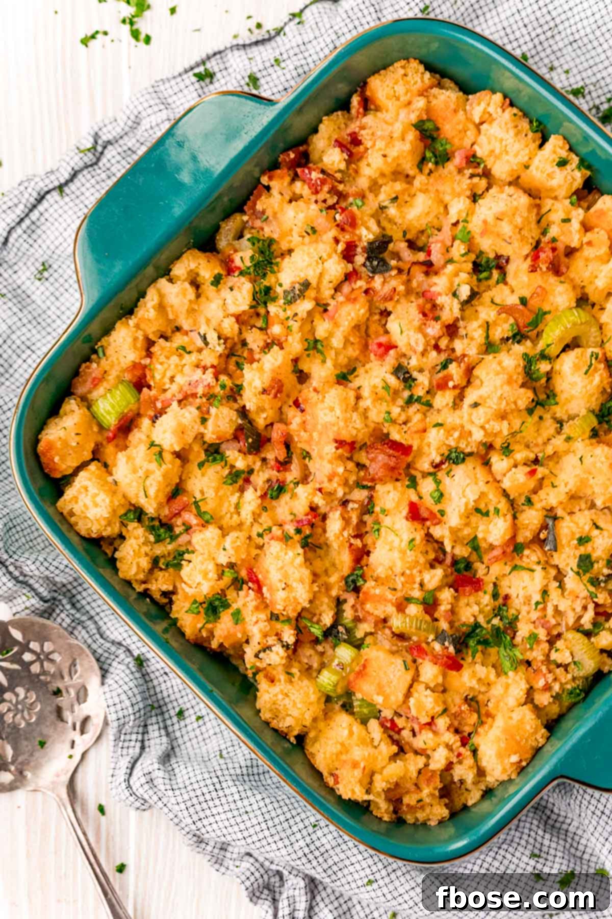 The Ultimate Cornbread Dressing 9 An overhead view of a casserole dish brimming with perfectly baked cornbread dressing, showcasing its golden-brown crust.