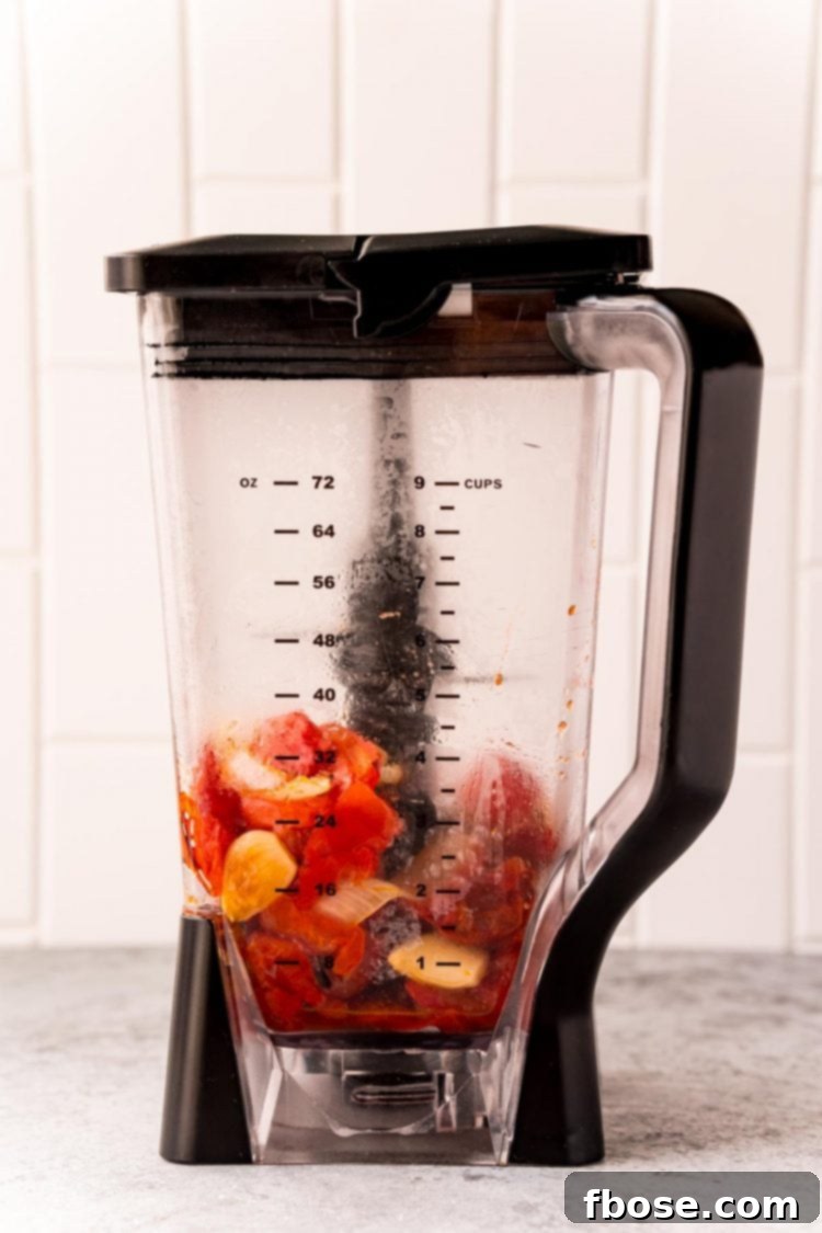 Roasted tomatoes and onions in a blender.