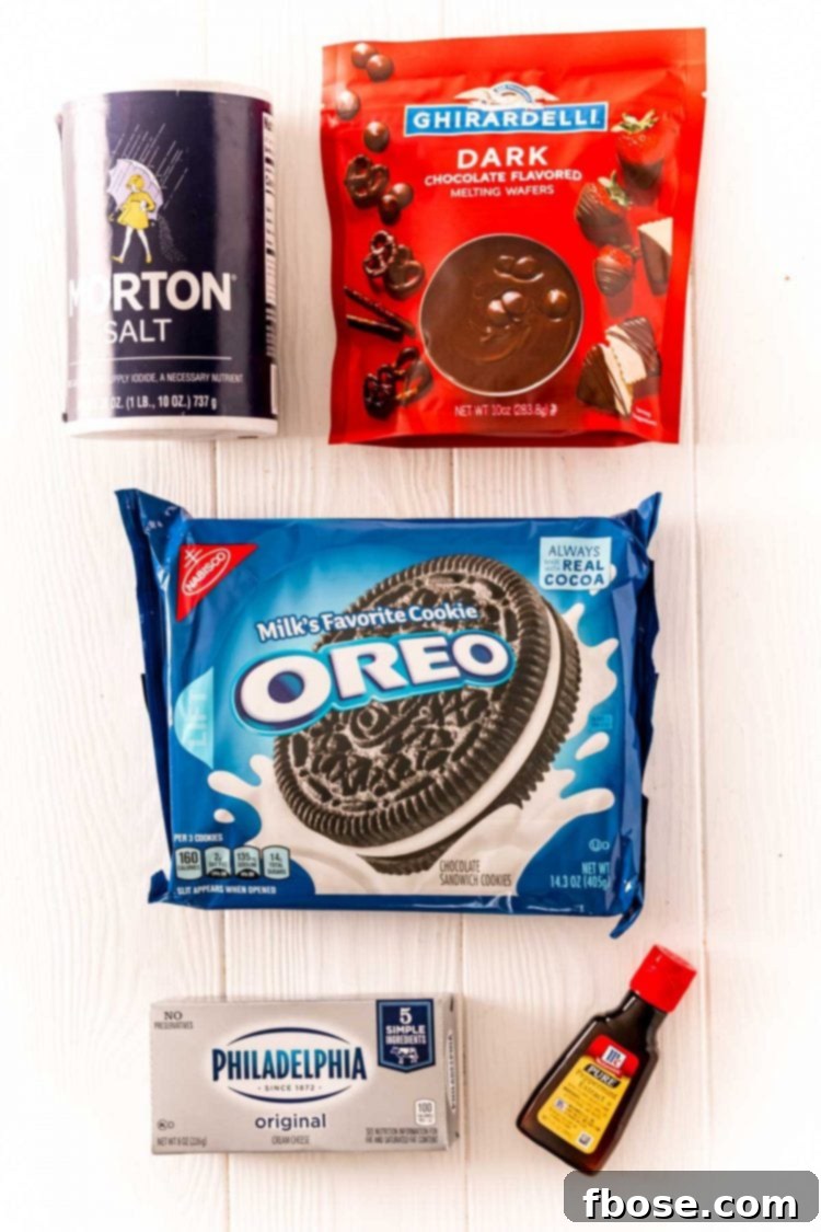 Ingredients for making Peppermint Oreo Balls artfully arranged on a clean white table, ready for preparation.