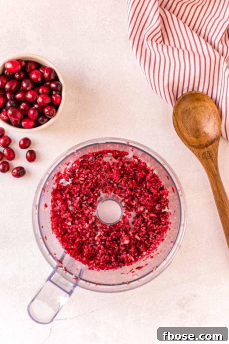 Overhead photo of cranberries that have been chopped in a food processor.