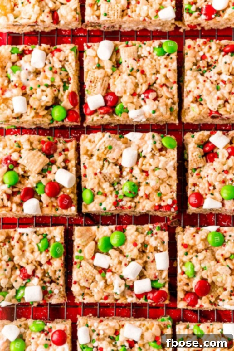 Overhead photo of perfectly sliced Christmas rice krispie treats arranged on a wire rack, ready to be served.