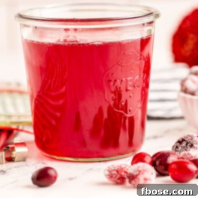 Ruby Red Elixir 8 Close up photo of a weck jar filled with cranberry simple syrup.