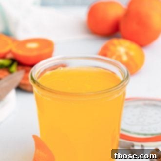 Close up photo of orange simple syrup.