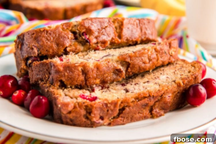 Close up photo of three slices of banana bread on a white plate.