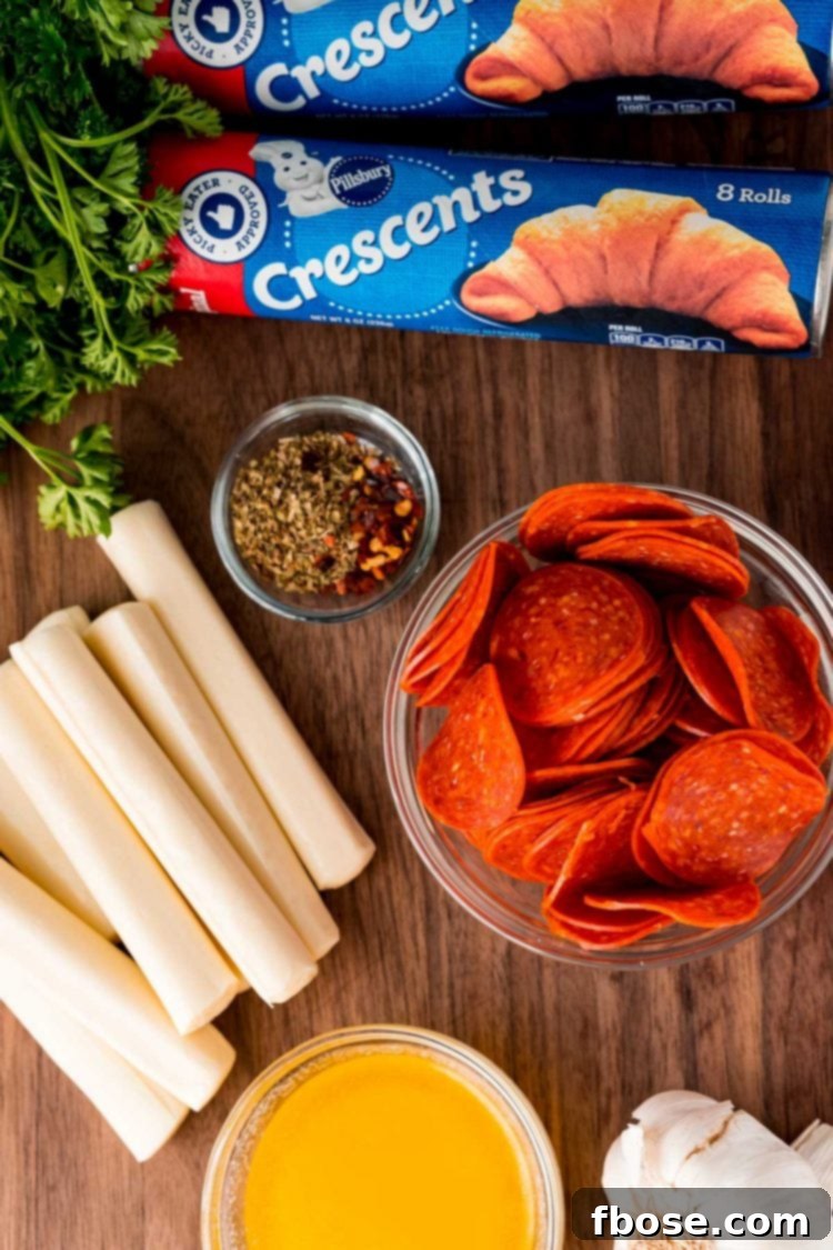Quick Cheesy Pizza Pinwheels 3 Ingredients for making pizza rolls laid out on a wooden cutting board, including crescent rolls, pepperoni, cheese sticks, butter, and seasonings.