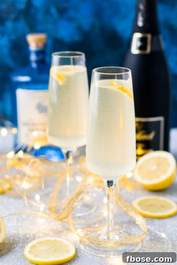 French 75 cocktail featuring gin, fresh lemon juice, simple syrup, and topped with sparkling champagne, garnished with a lemon twist, perfect for festive occasions.