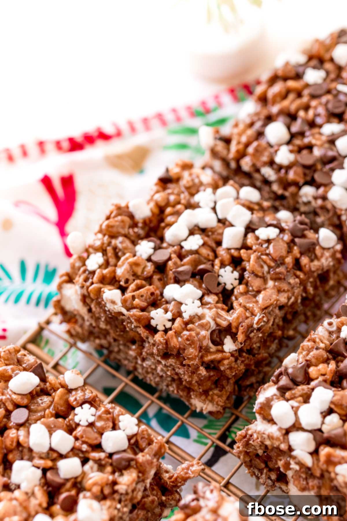 Toasty Cocoa Krispie Bars 4 Hot Chocolate rice krispie treats on a wire rack.